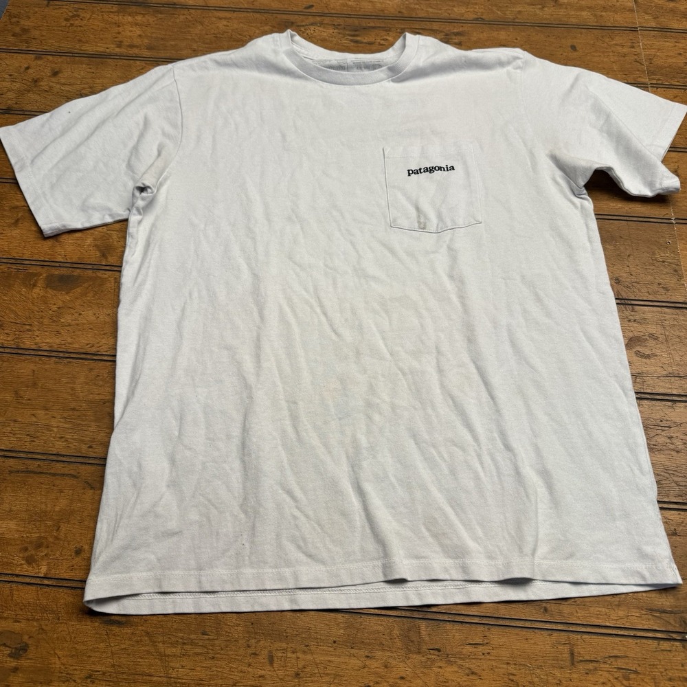 Patagonia T-Shirt with Chest Pocket - Blue - Large Graphic on Back - Men's Small